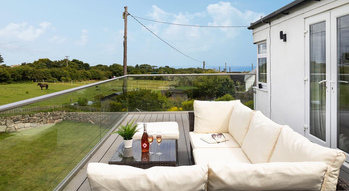 Spend time sharing holiday stories while enjoying the Cornish countryside from your secluded balcony. 