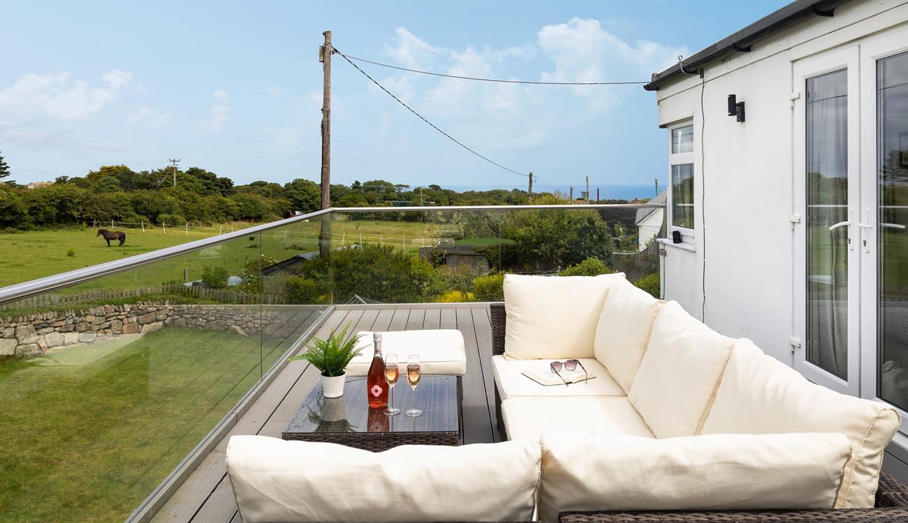 Spend time sharing holiday stories while enjoying the Cornish countryside from your secluded balcony. 