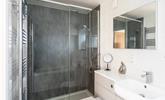 The large walk-in shower is perfect for washing the sand away at the end of the day. - Thumbnail Image