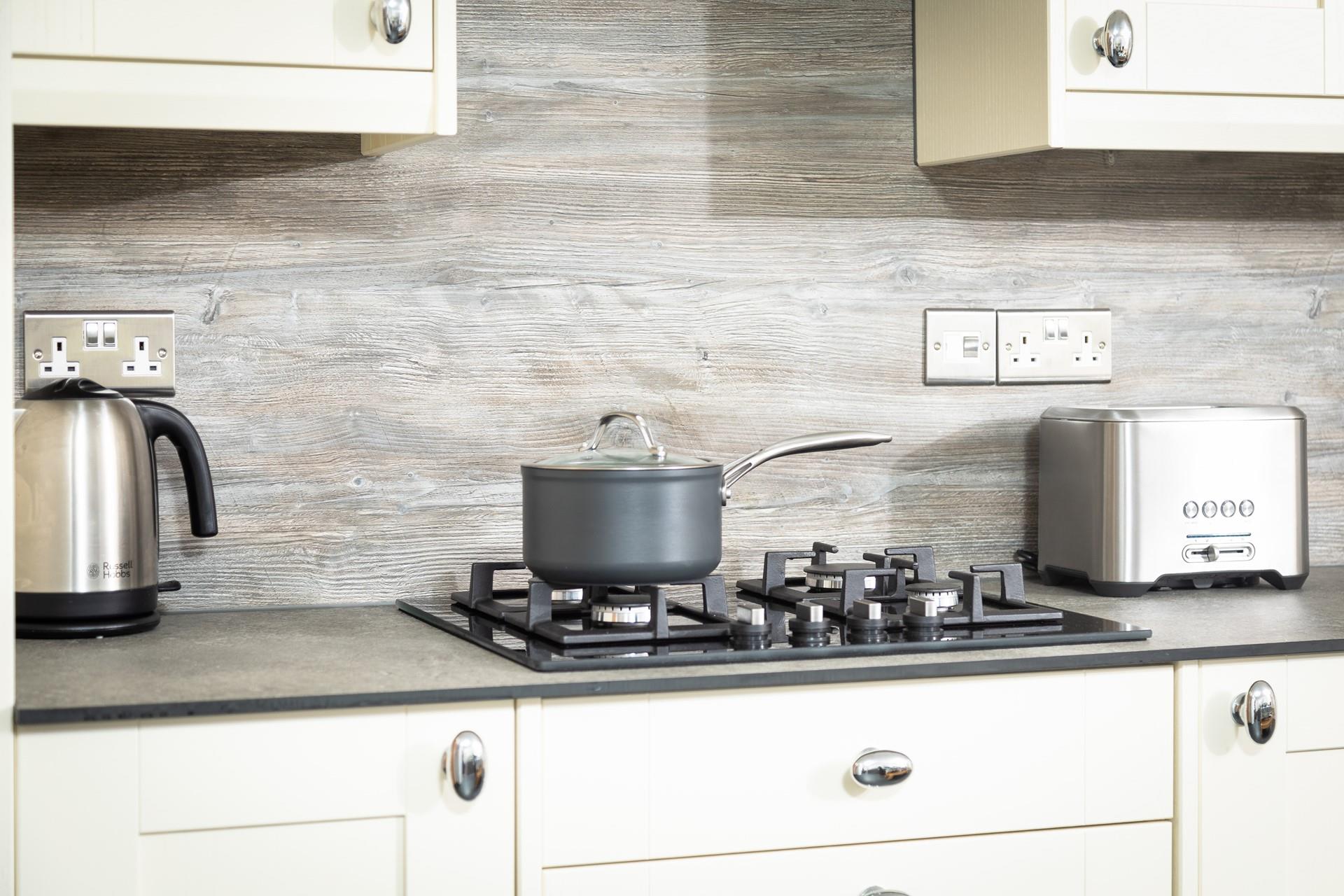 The kitchen is well-equipped with all the essentials for your stay at Garth Cottage. 