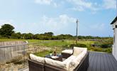 Relax on the large balcony, glass of wine in hand, overlooking the meadows and distant sea views.  - Thumbnail Image