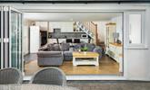 The open plan living area benefits from bi-fold doors that open onto the private patio and garden.  - Thumbnail Image