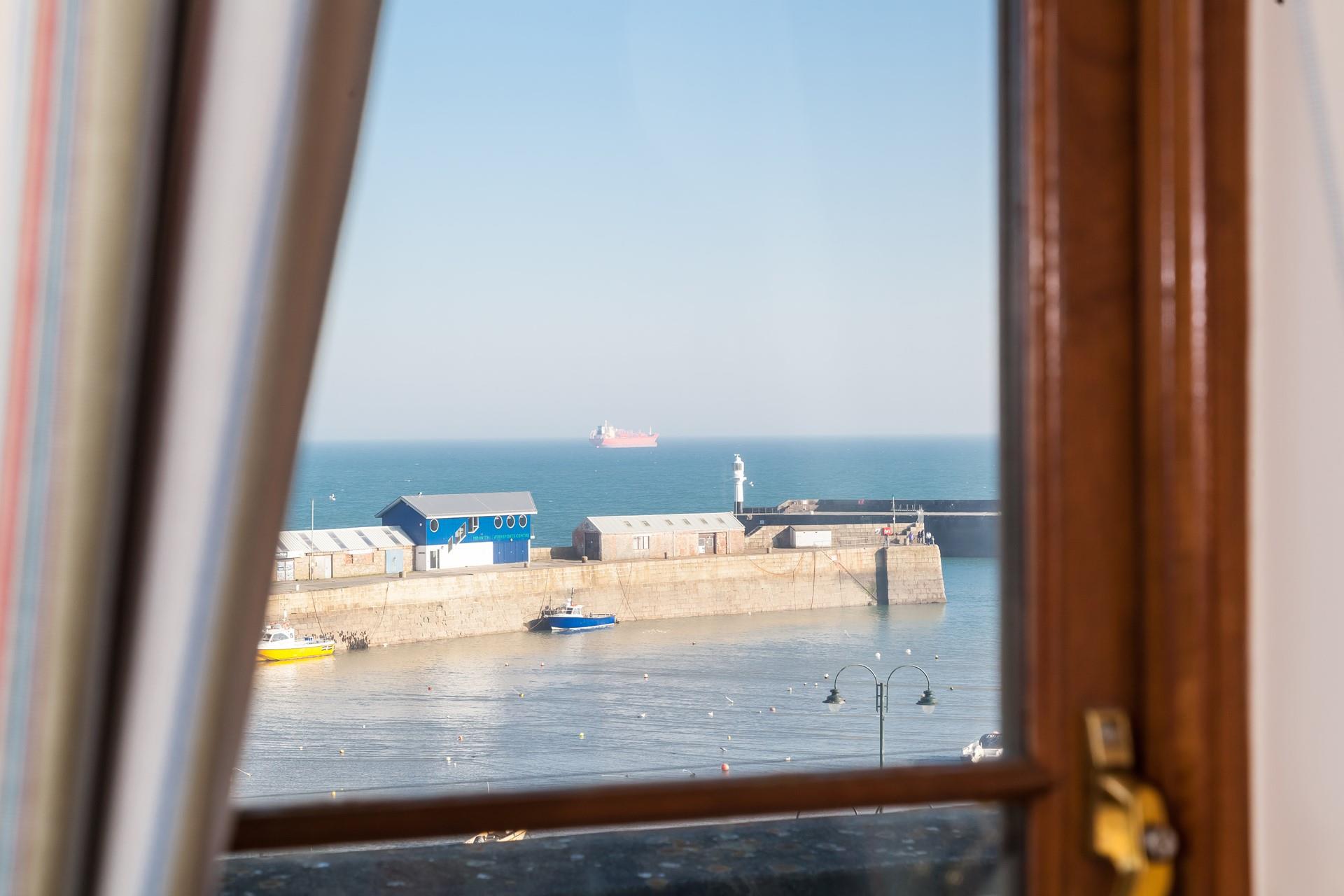 Enjoy sea views from the comfortable sitting room.