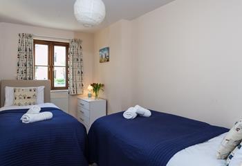Bedroom 2 has cosy twin beds for children or adults.