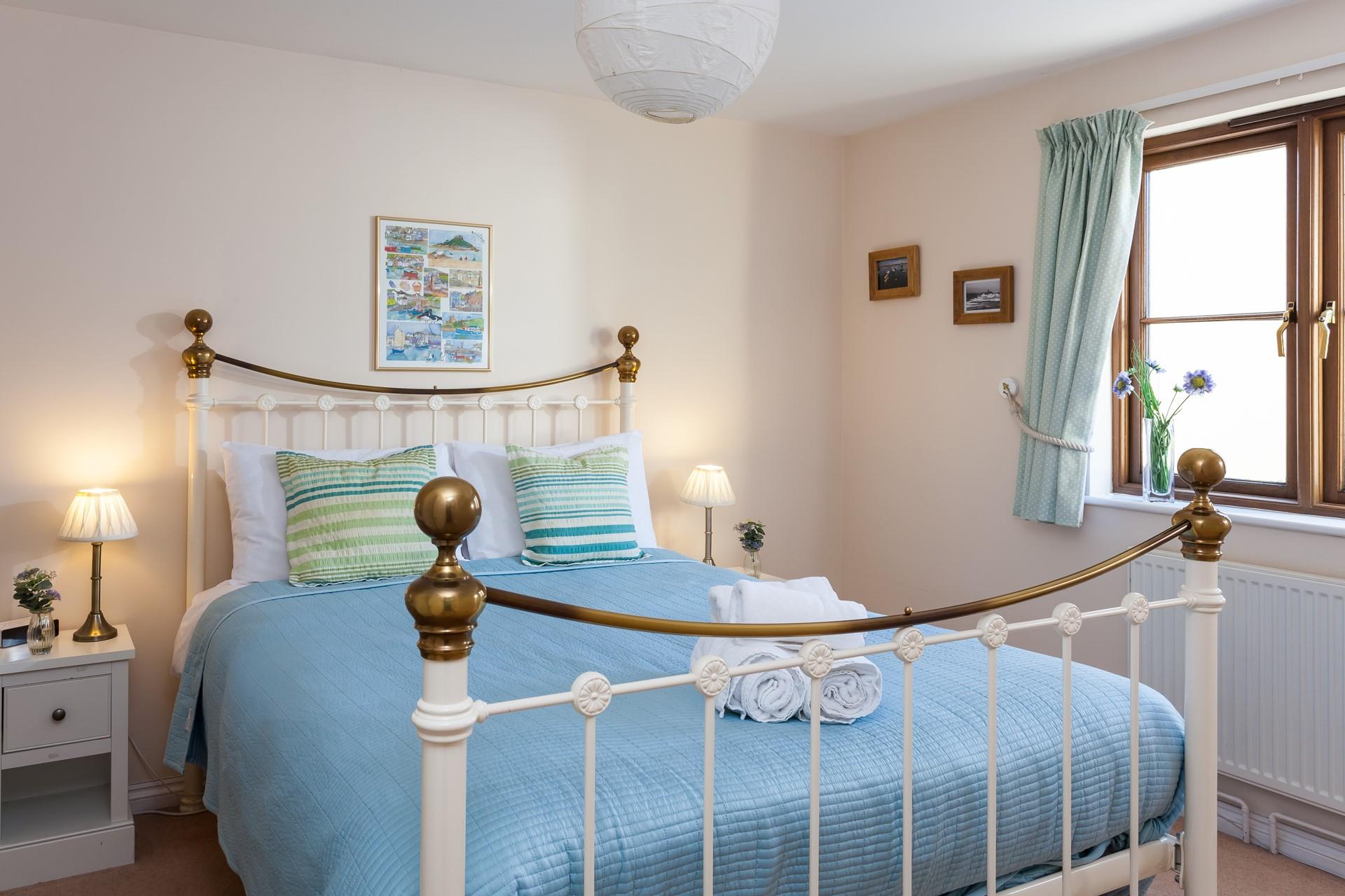 The main bedroom has a comfy double bed to tuck into each night. 