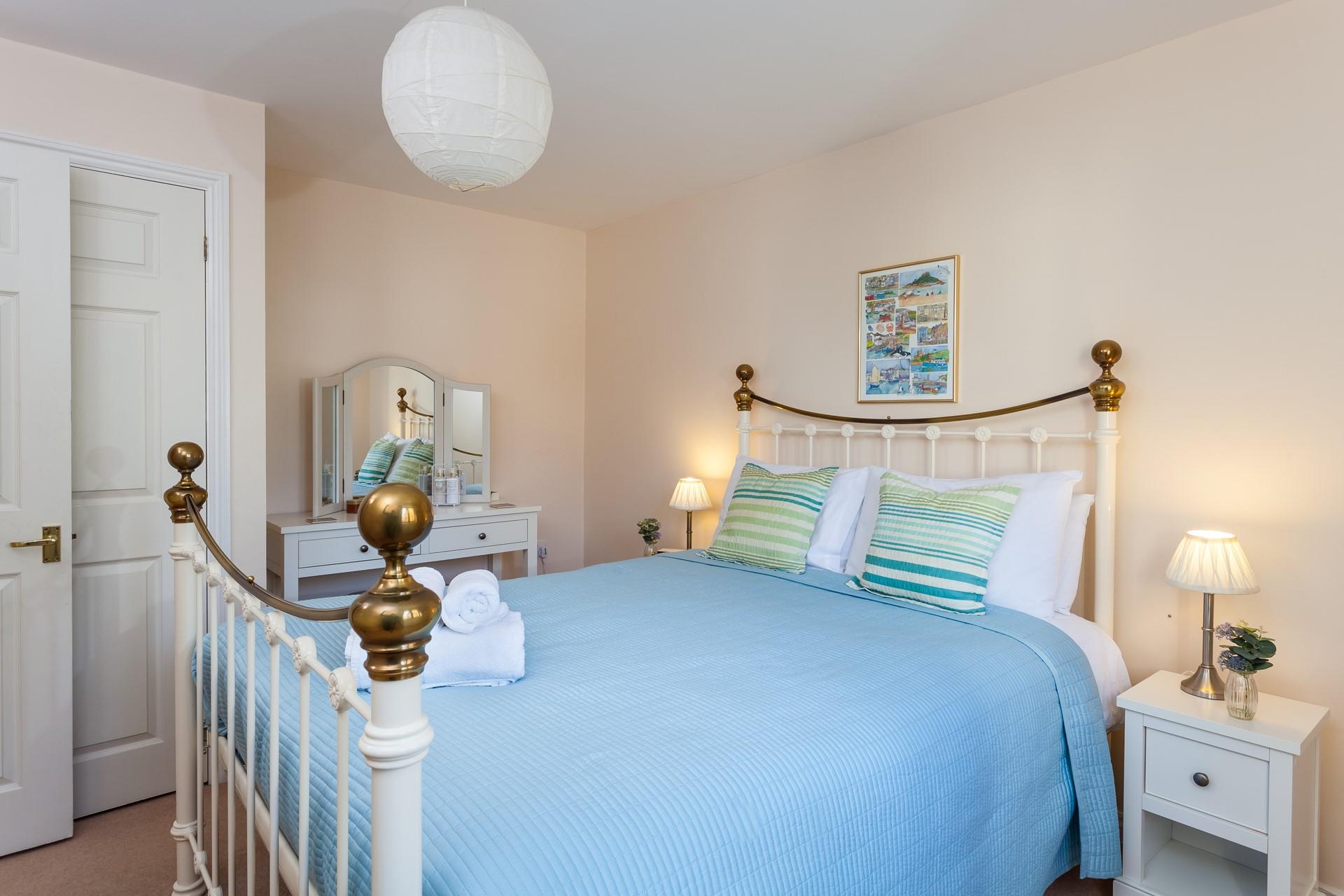 Fluffy towels and fresh sheets await in bedroom 1.