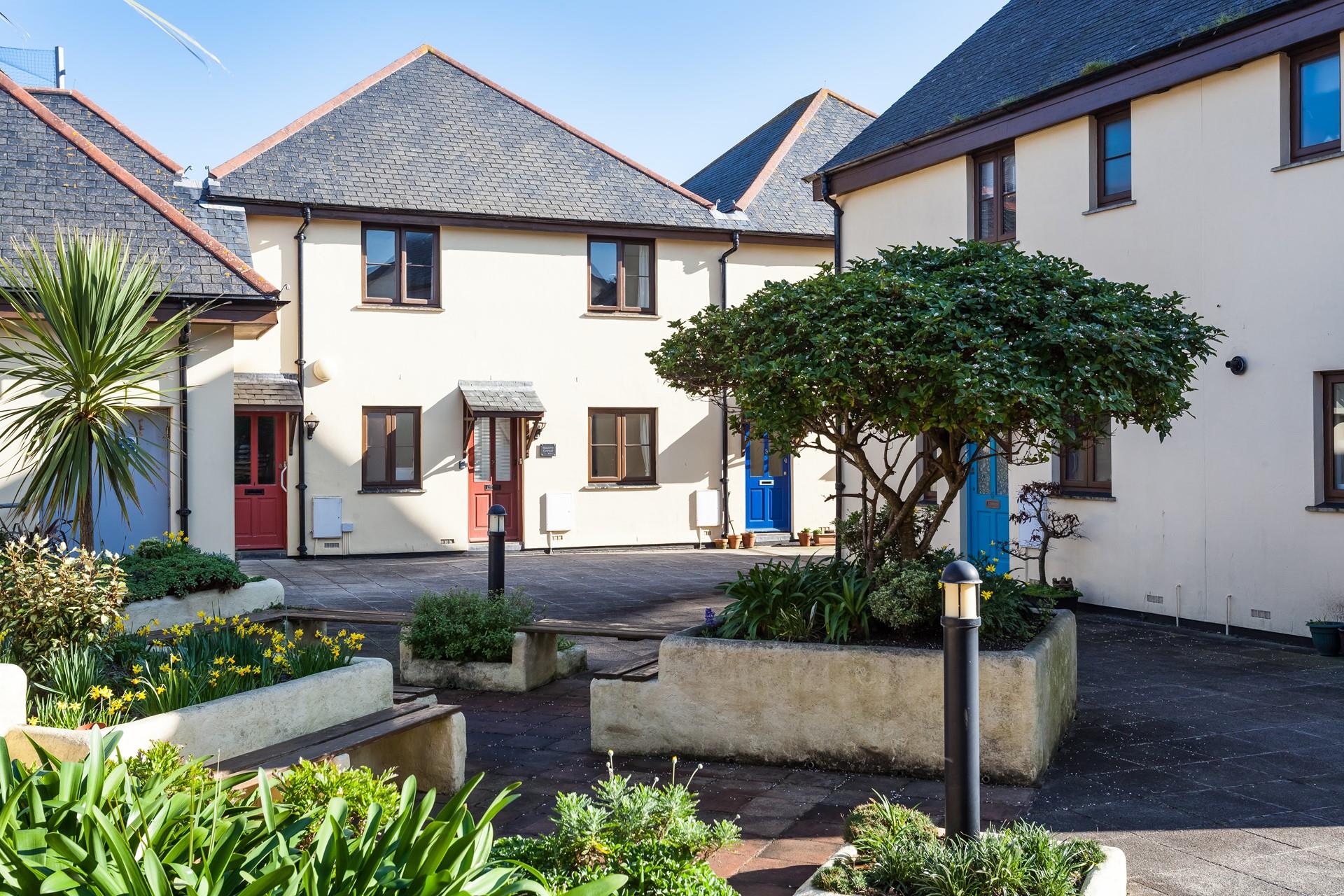 The communal courtyard offers a place to sit in the sun.