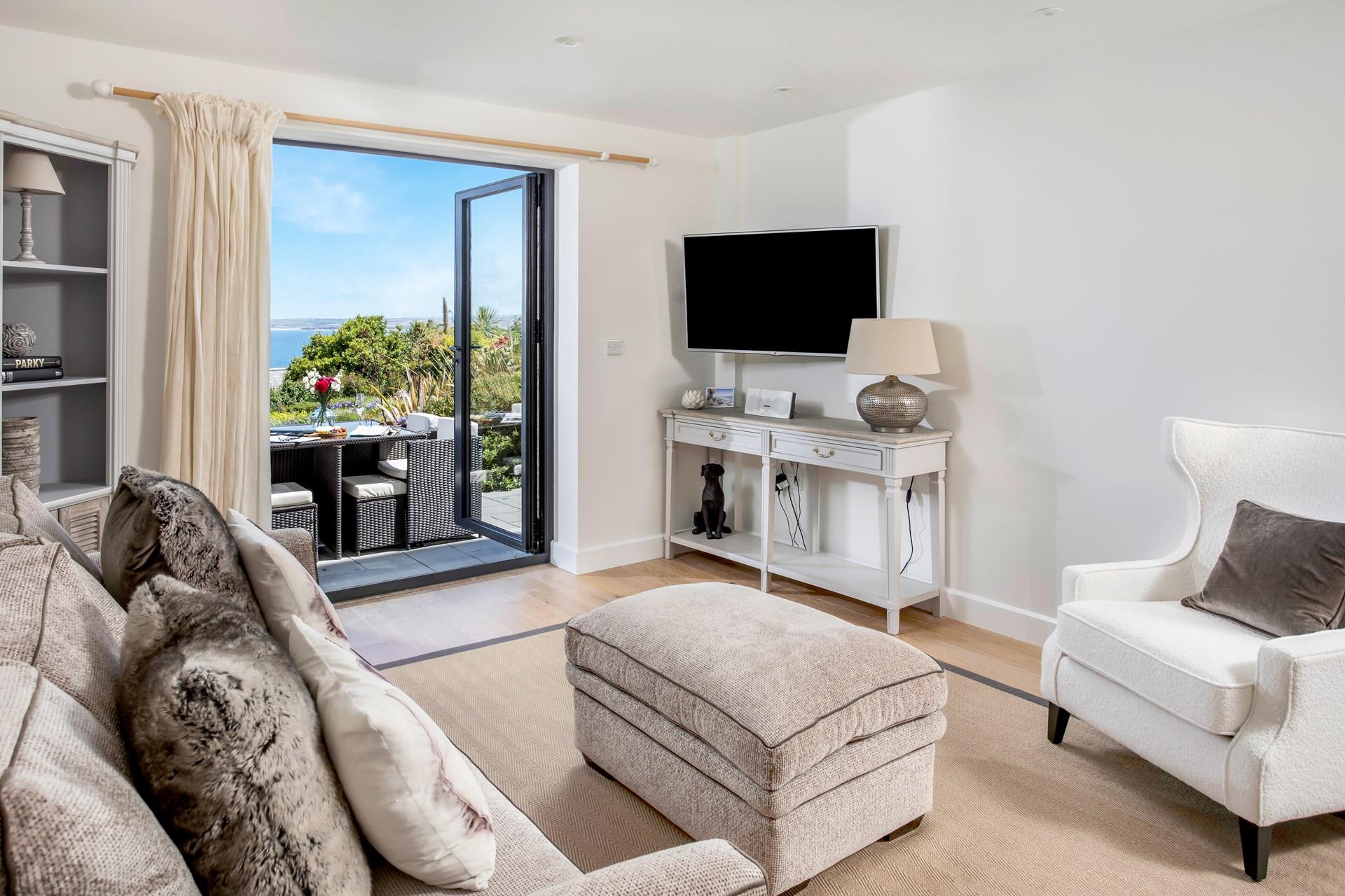 Open the patio doors and let the warm summer breeze run through the open plan apartment.