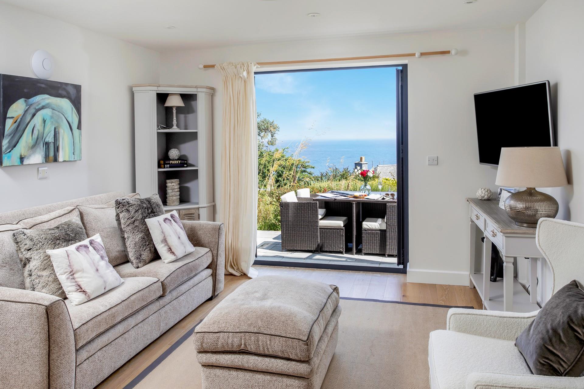 Sink into the plush sofa and enjoy a film night in the stylish sitting room.