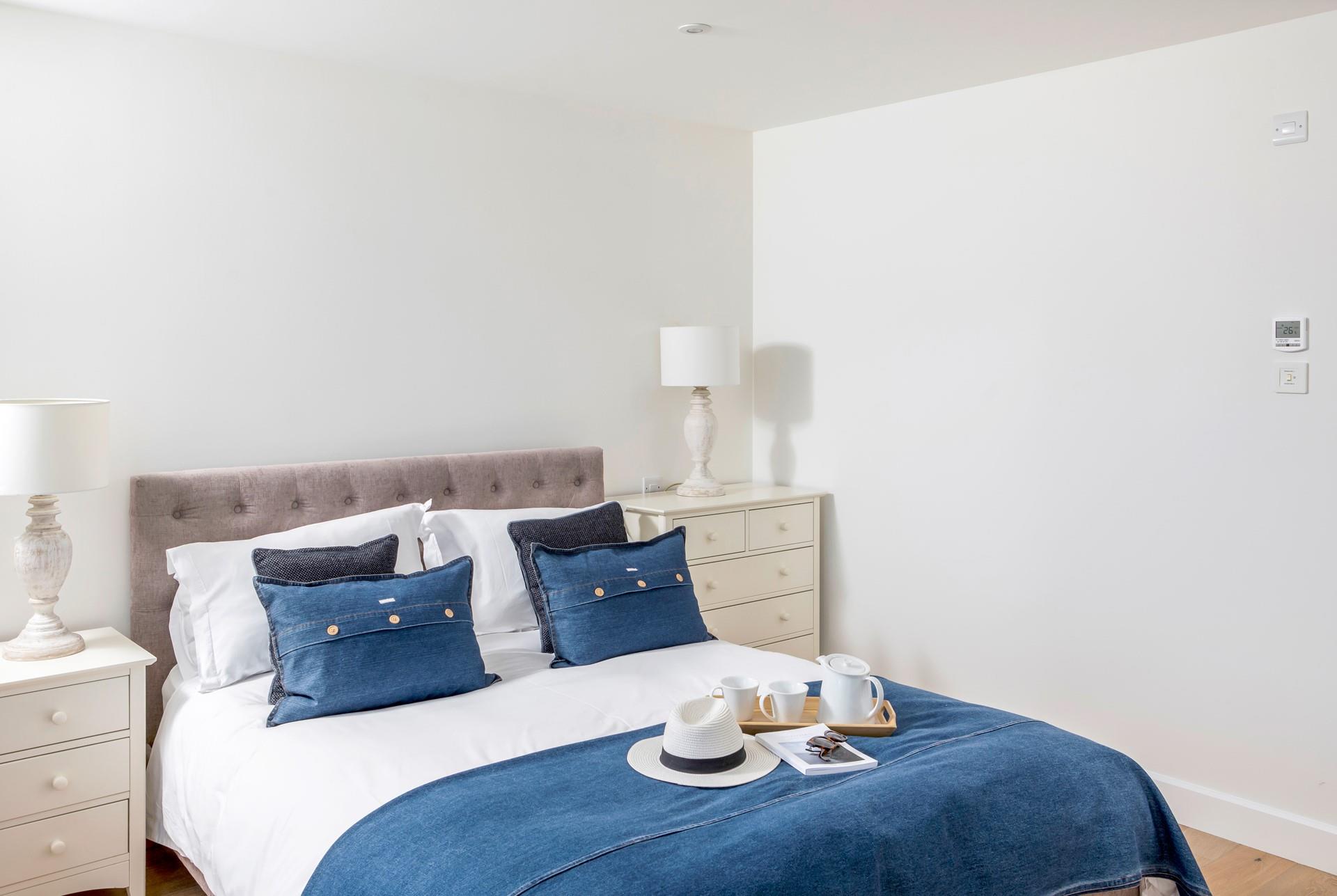 Drift off to calming, coastal blues in the bedroom.