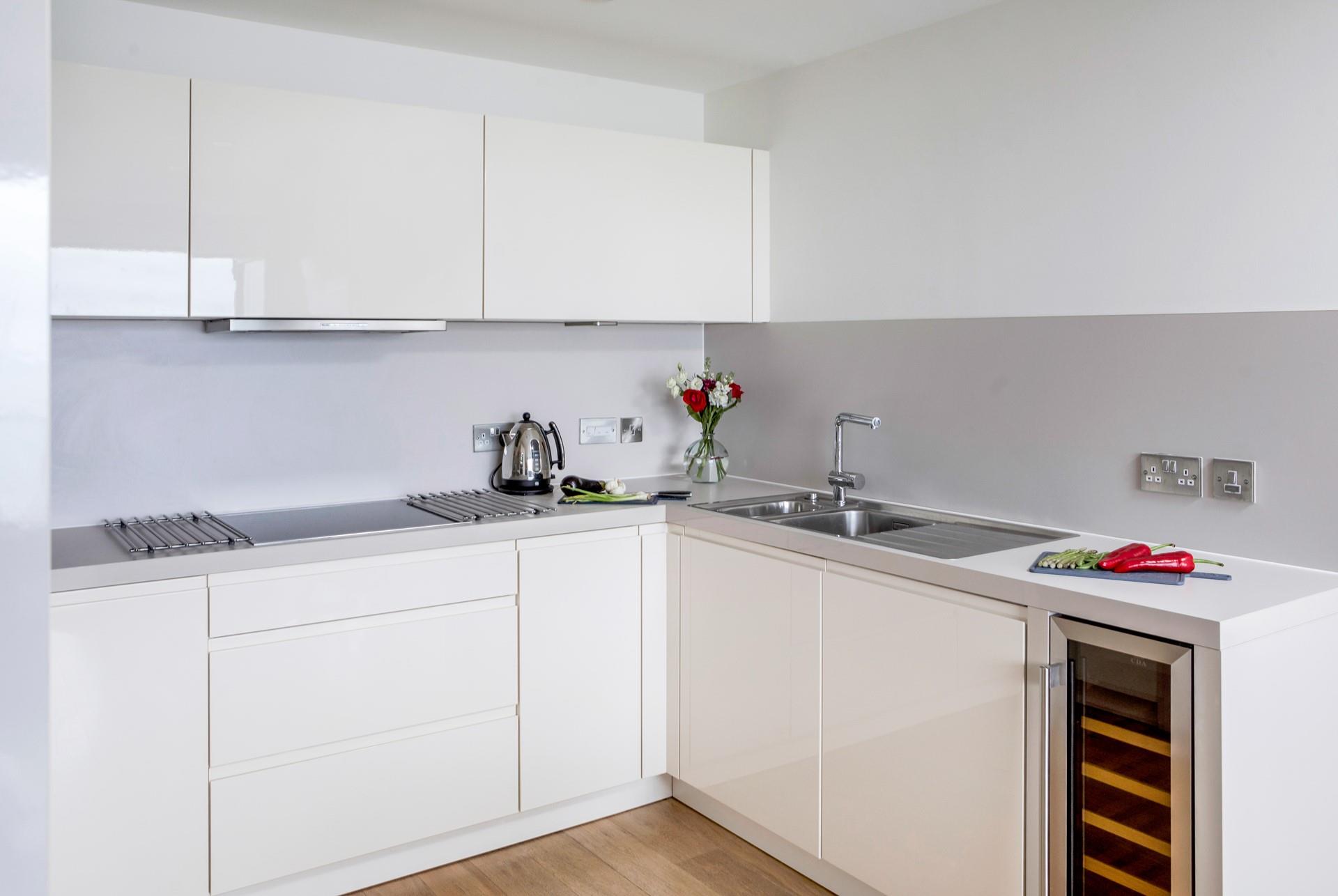 The sleek and modern kitchen is perfect for rustling up delicious meals.