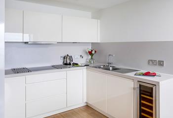 The sleek and modern kitchen is perfect for rustling up delicious meals.
