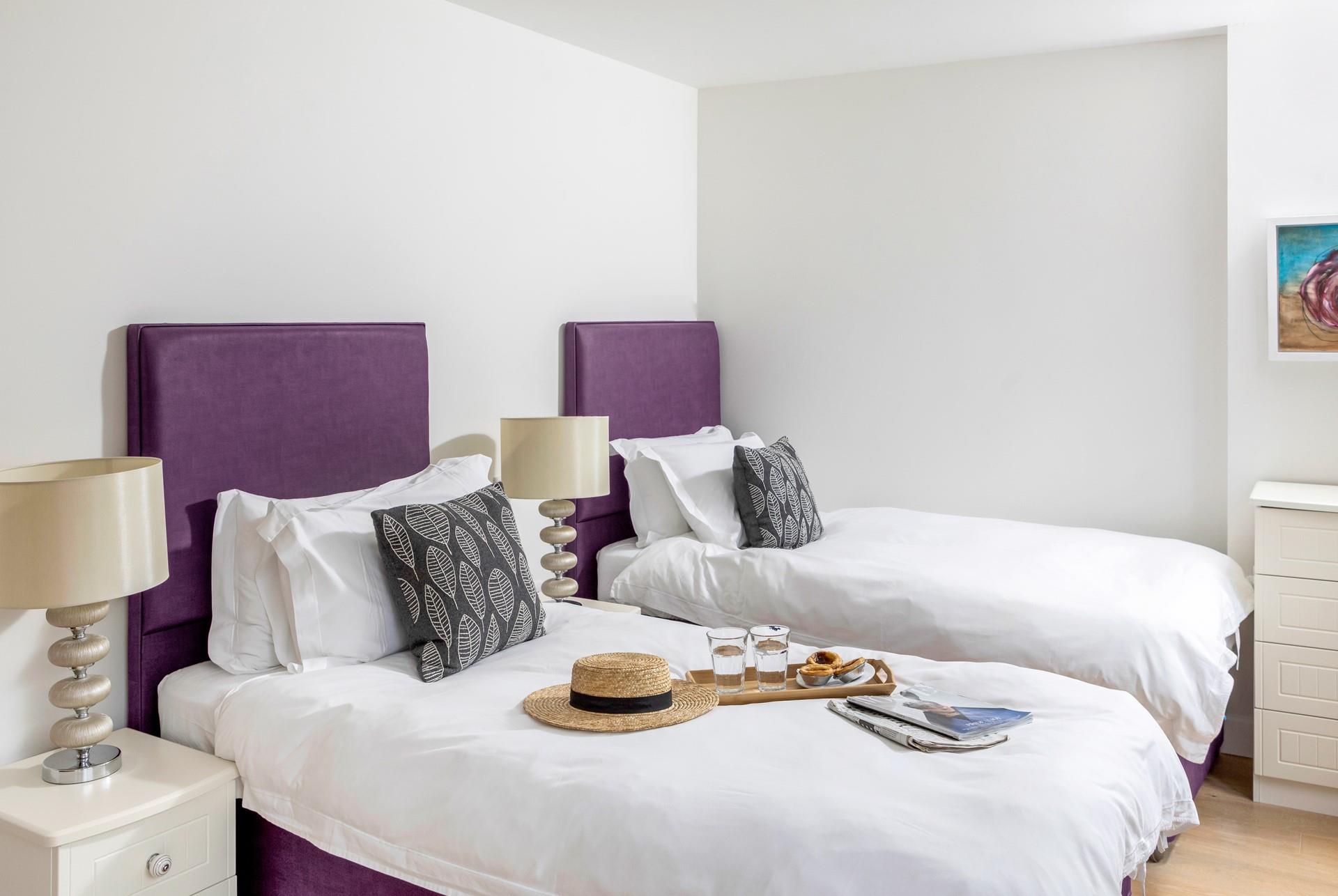 Bedroom 2 has cosy twin beds to tuck into each evening.