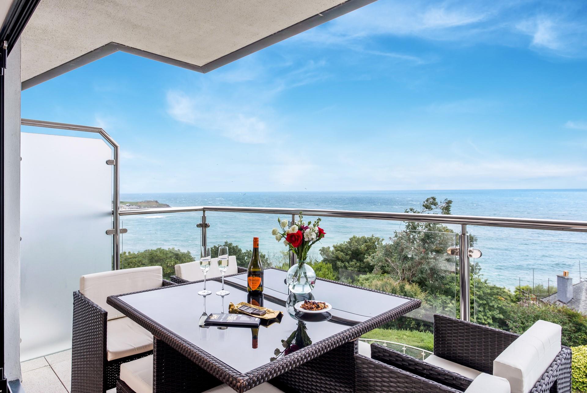 Pour a glass of bubbles and take in the breathtaking sea views.