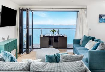 Relax and unwind, taking in the breathtaking sea view.