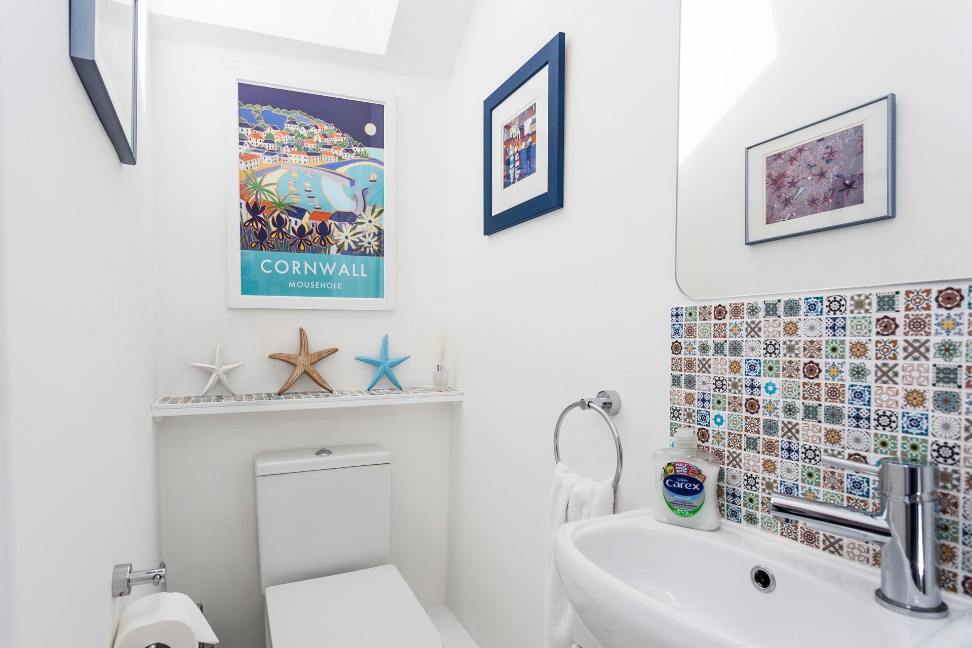 The bathroom is downstairs just off the kitchen. There is also a cloakroom on the upper floor next to the bedrooms.