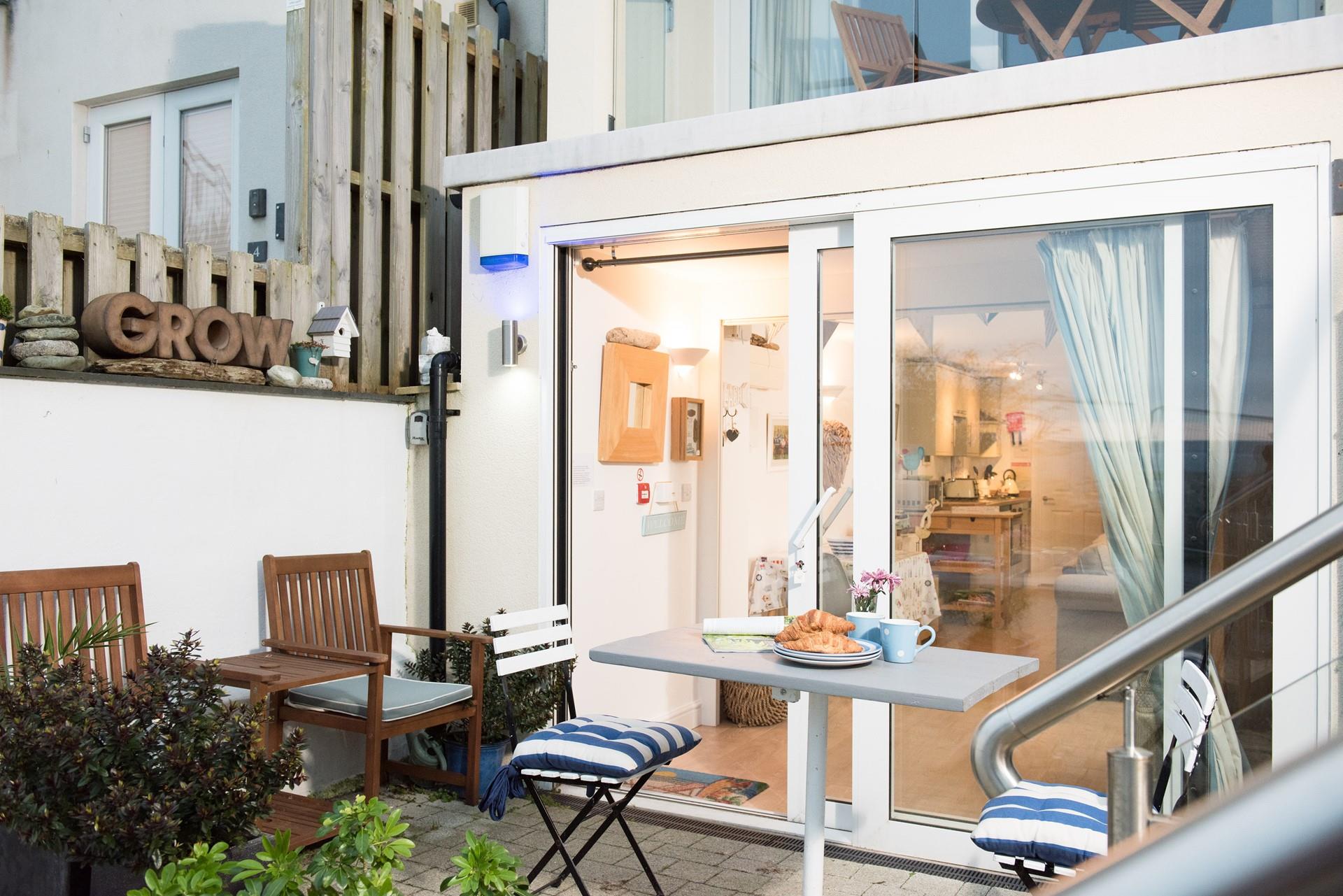 Enjoy a coffee outside your couple's retreat in the morning before heading off to the beach. 