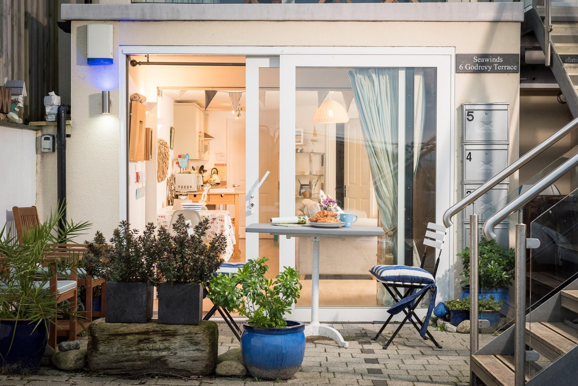 There's seating for two outside the apartment where you can enjoy breakfast al fresco. 