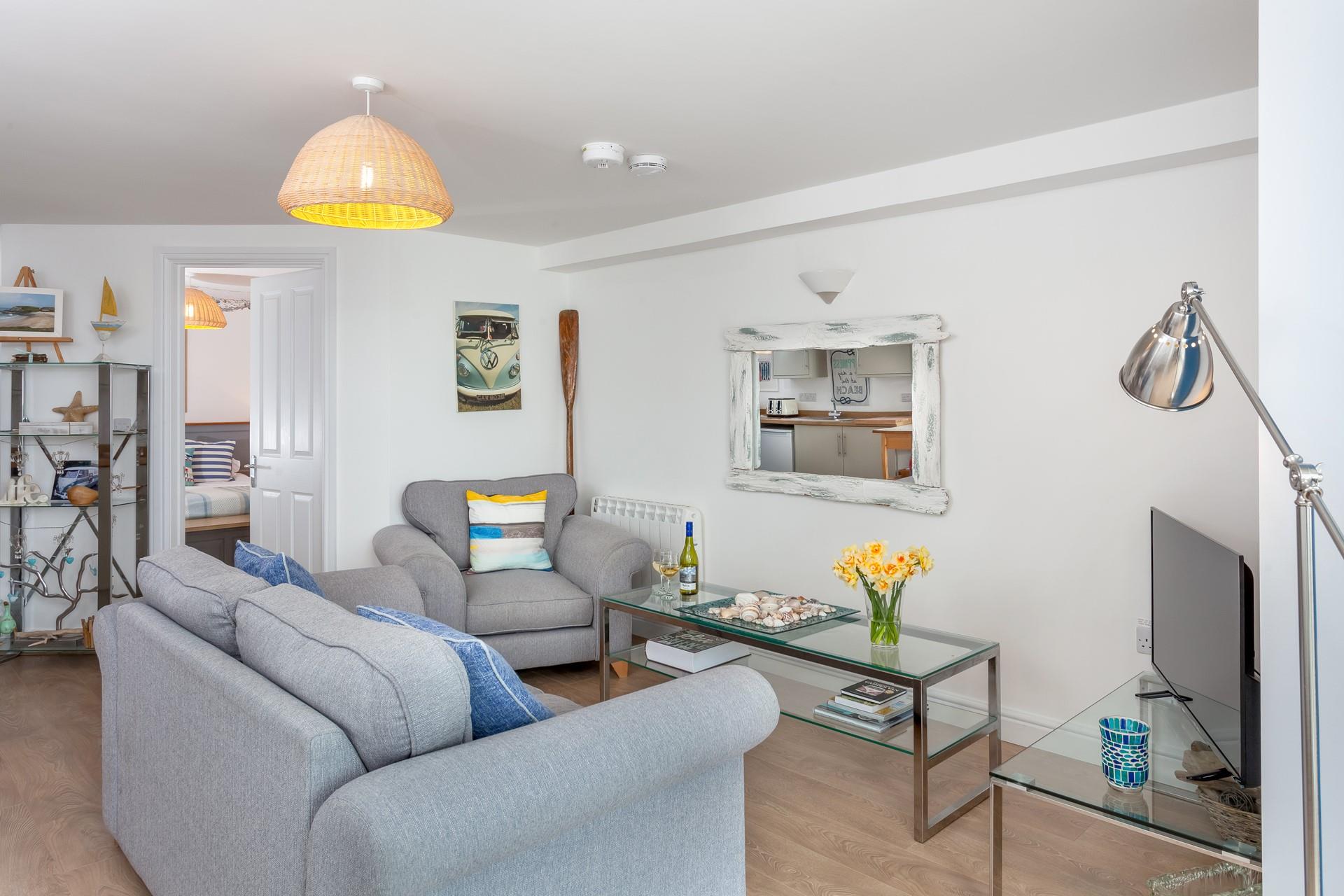 The homely lounge has gorgeous coastal interiors.