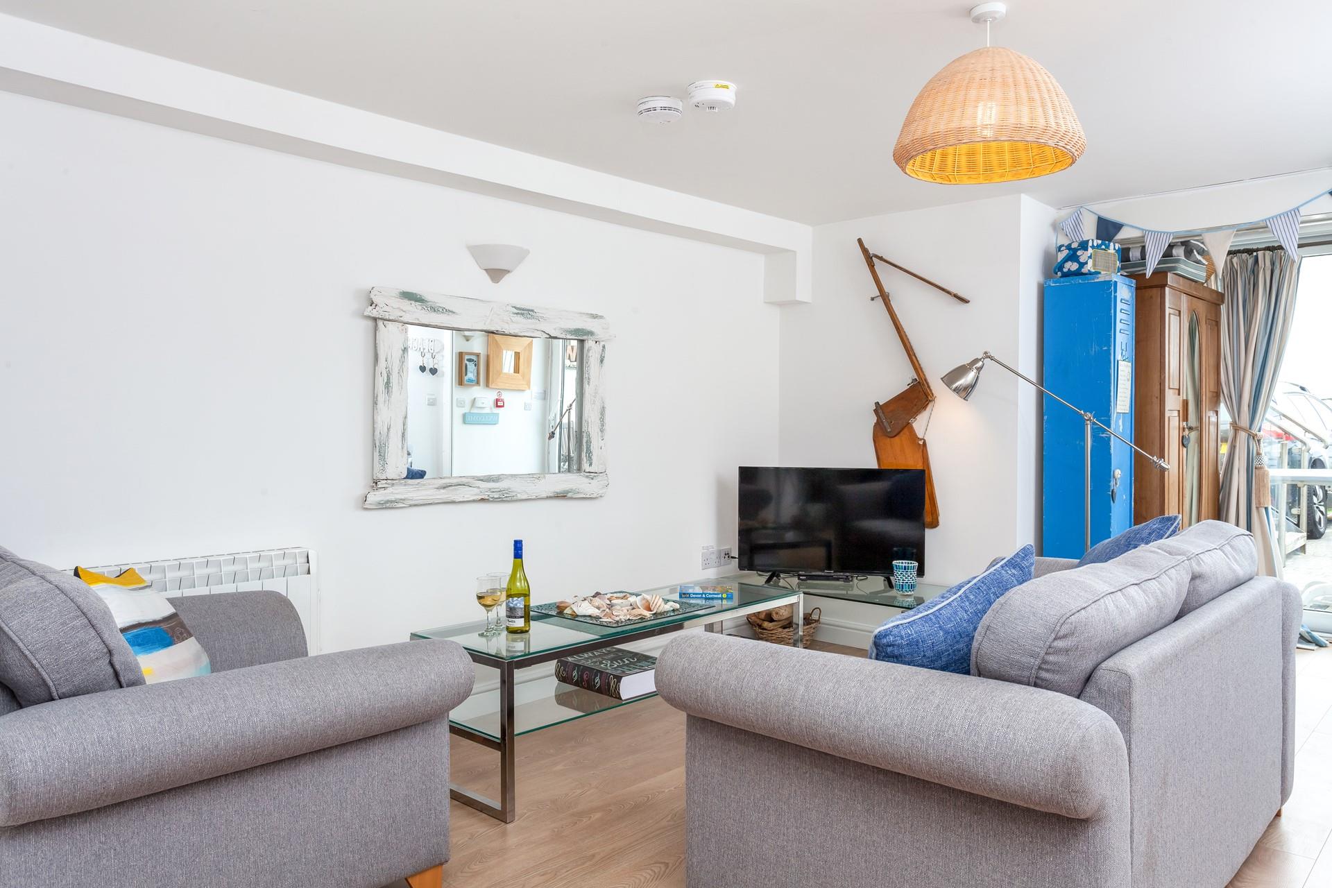 Unwind with a glass of wine in the comfy sitting room. 