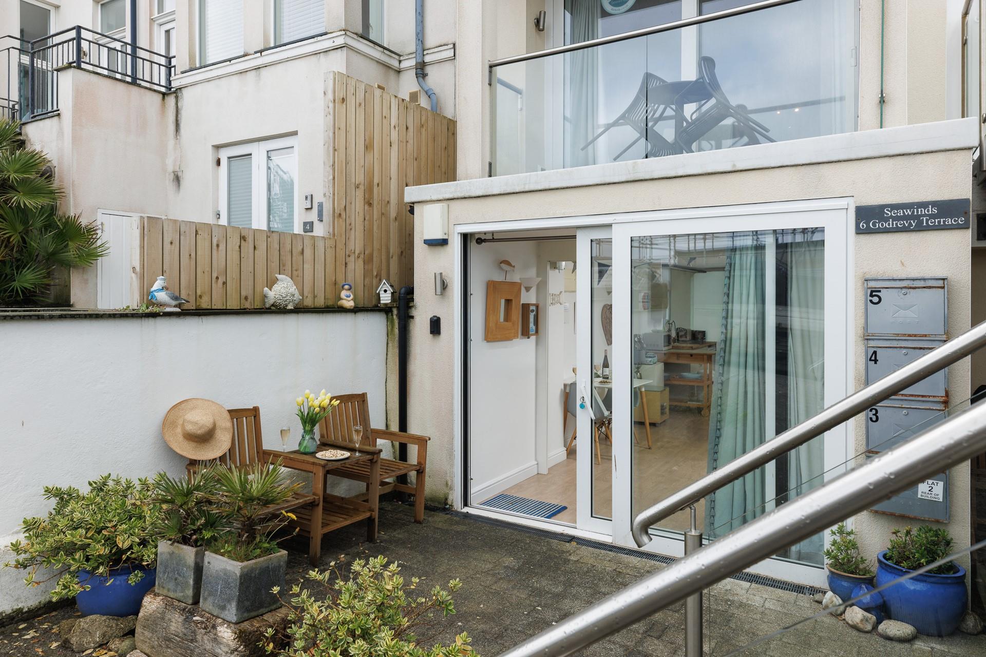 Enjoy a coffee outside your retreat before heading off to the beach. 