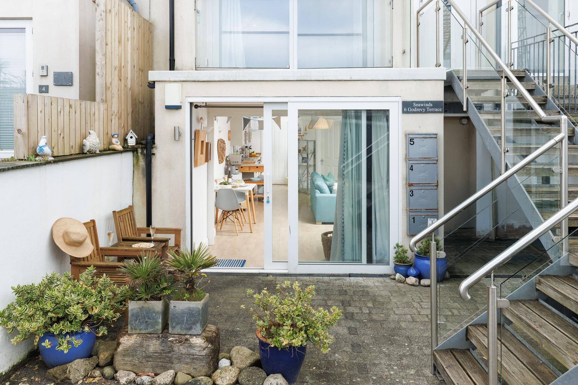 There's seating for two outside the apartment where you can enjoy breakfast al fresco. 