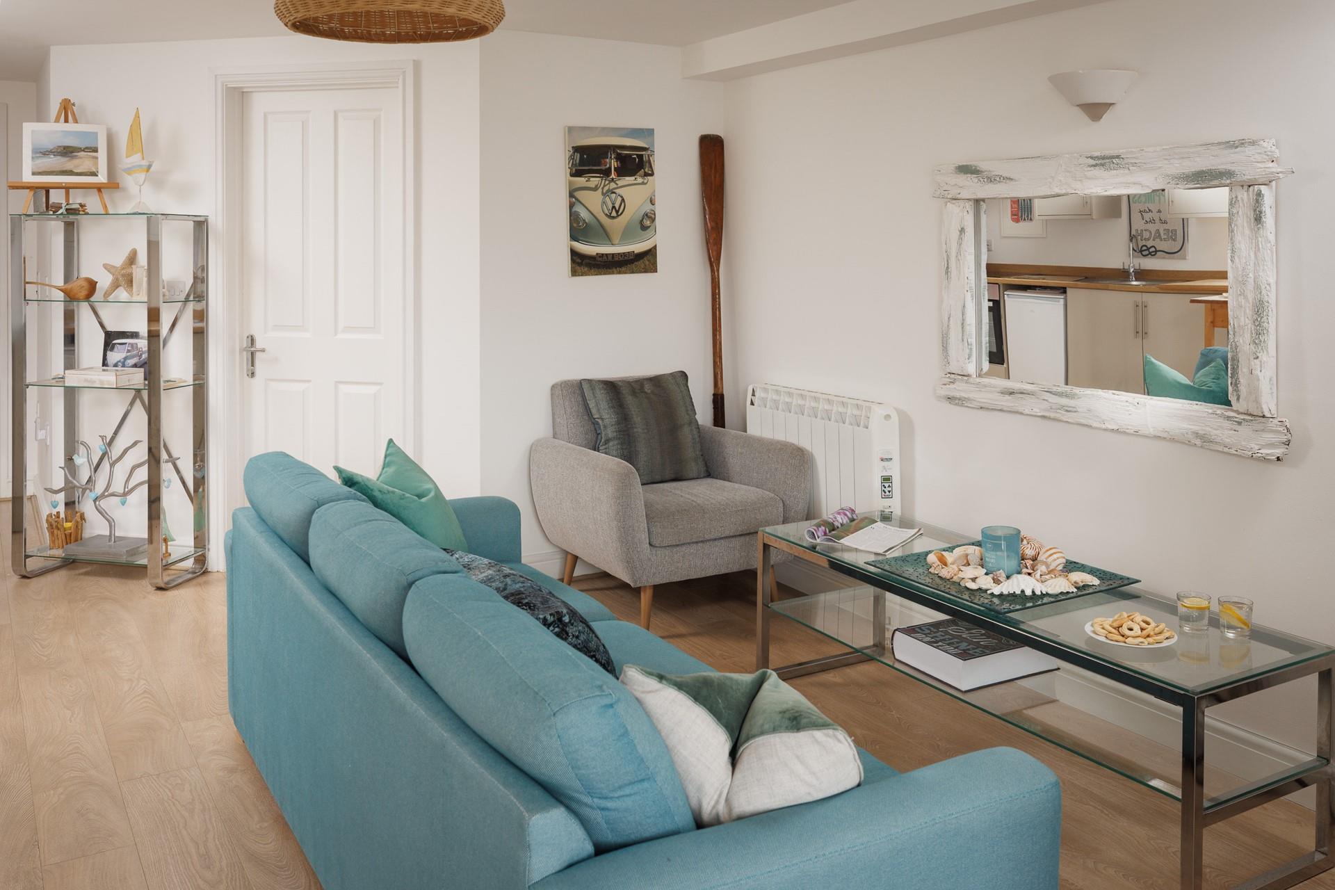 The homely lounge has gorgeous coastal interiors.