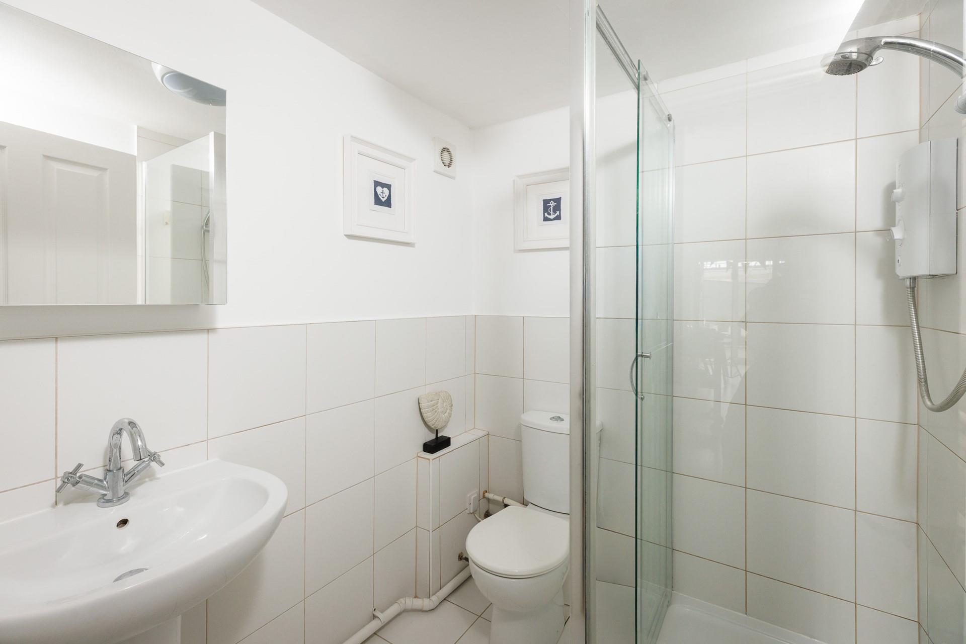 Freshen up after a day at the beach in the lovely shower room. 