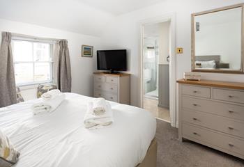 Bedroom 1 benefits from an en suite, providing extra space and privacy to get ready.