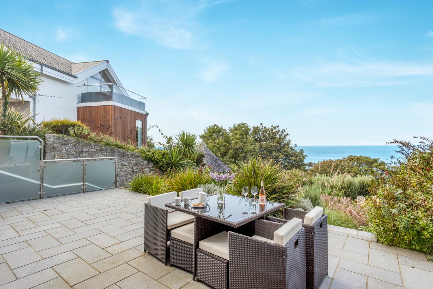 Spend balmy evenings dining on the patio, surrounded by sub-tropical gardens, as the sun goes down.