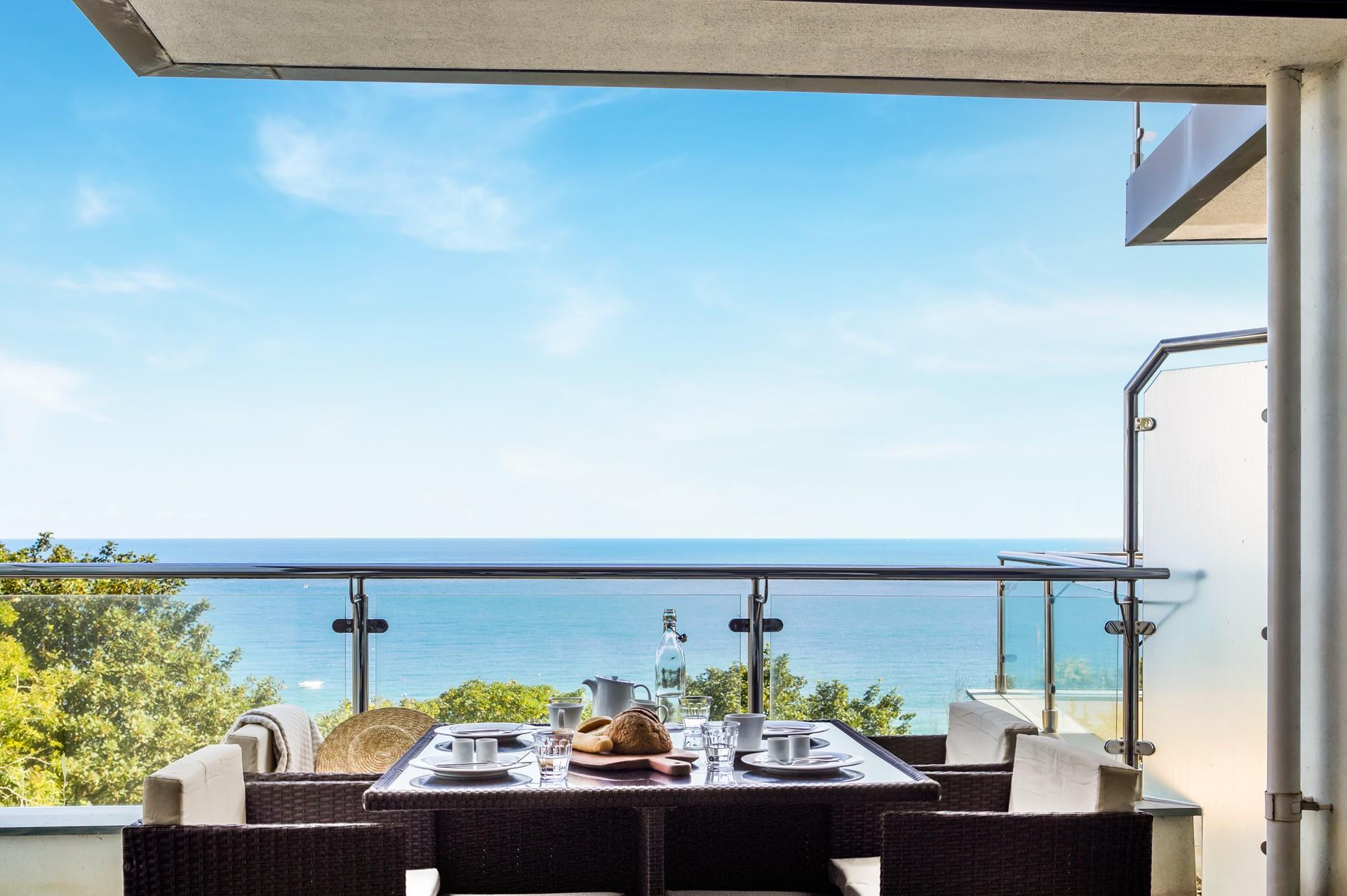 Take a hearty breakfast of warm bread and pastries outside to the balcony.