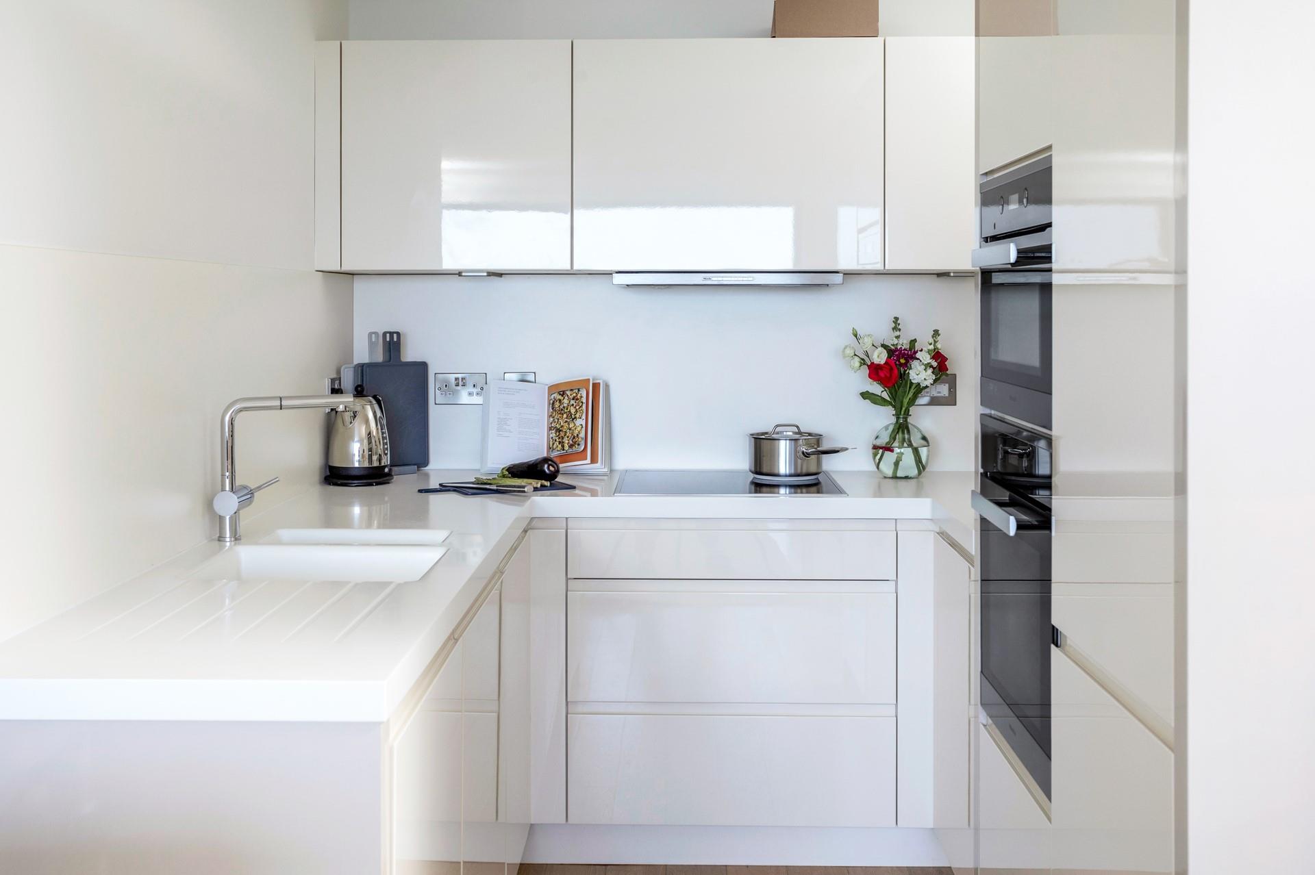 The kitchen is sleek and contemporary, perfect for cooking up a storm.