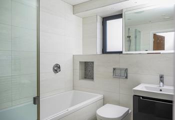 The family bathroom has automatic entry lighting and a well-sized bath.