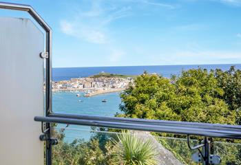 The private glass balcony is the perfect vantage point for the wonderful sea view.