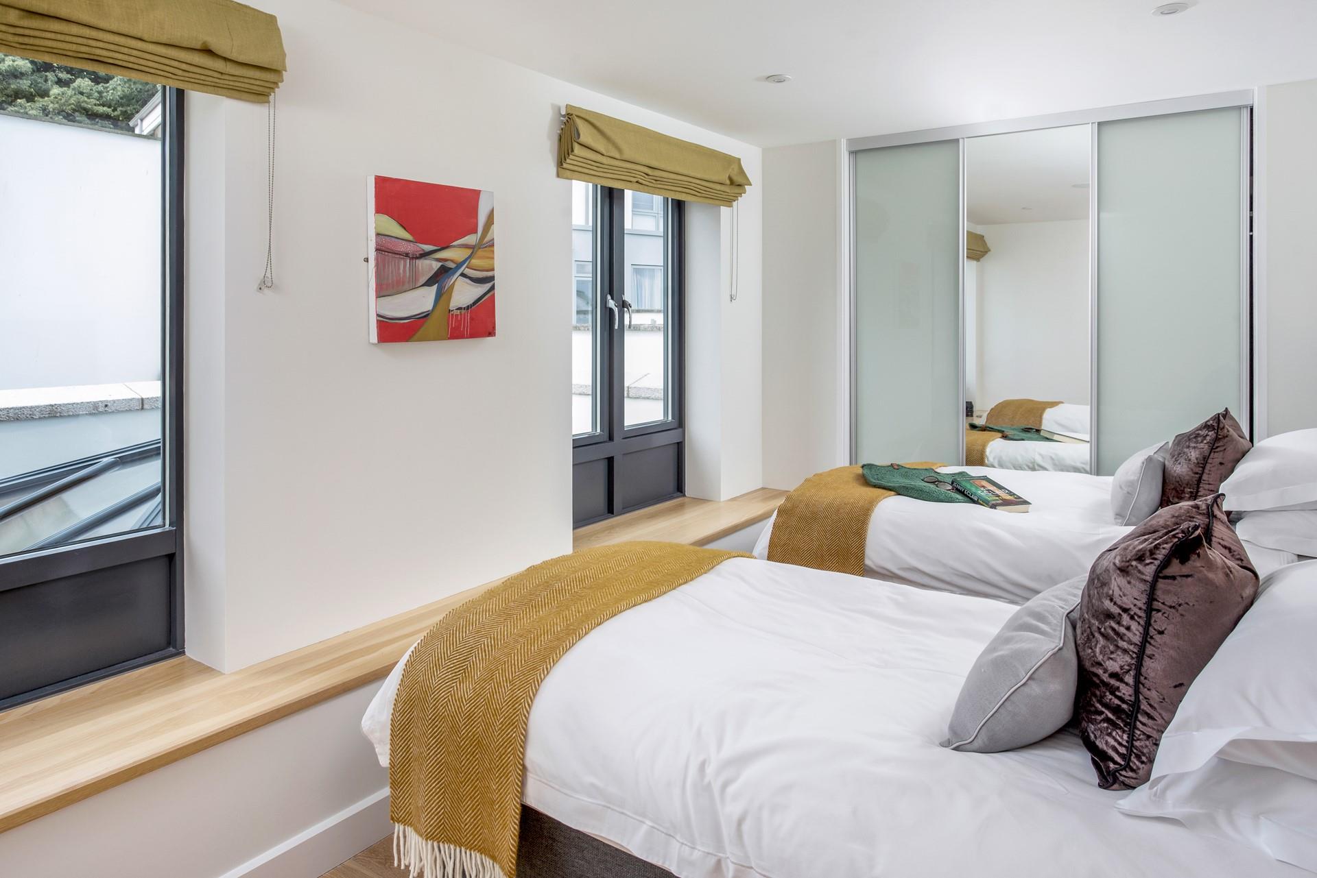 The twin beds are perfect for young adults or children to settle into.