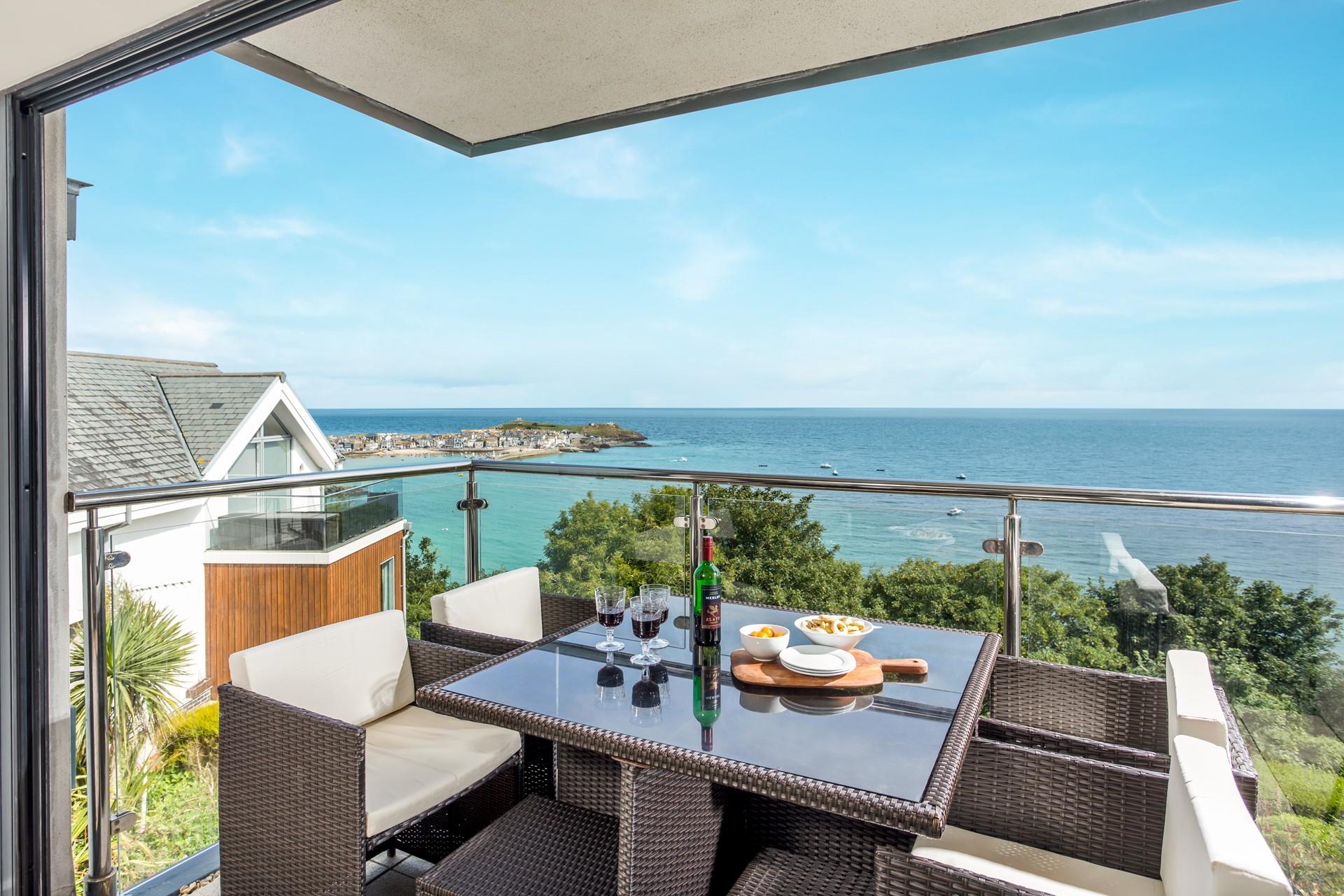 Pour yourself a glass of wine to sip as the sun goes down on the balcony.