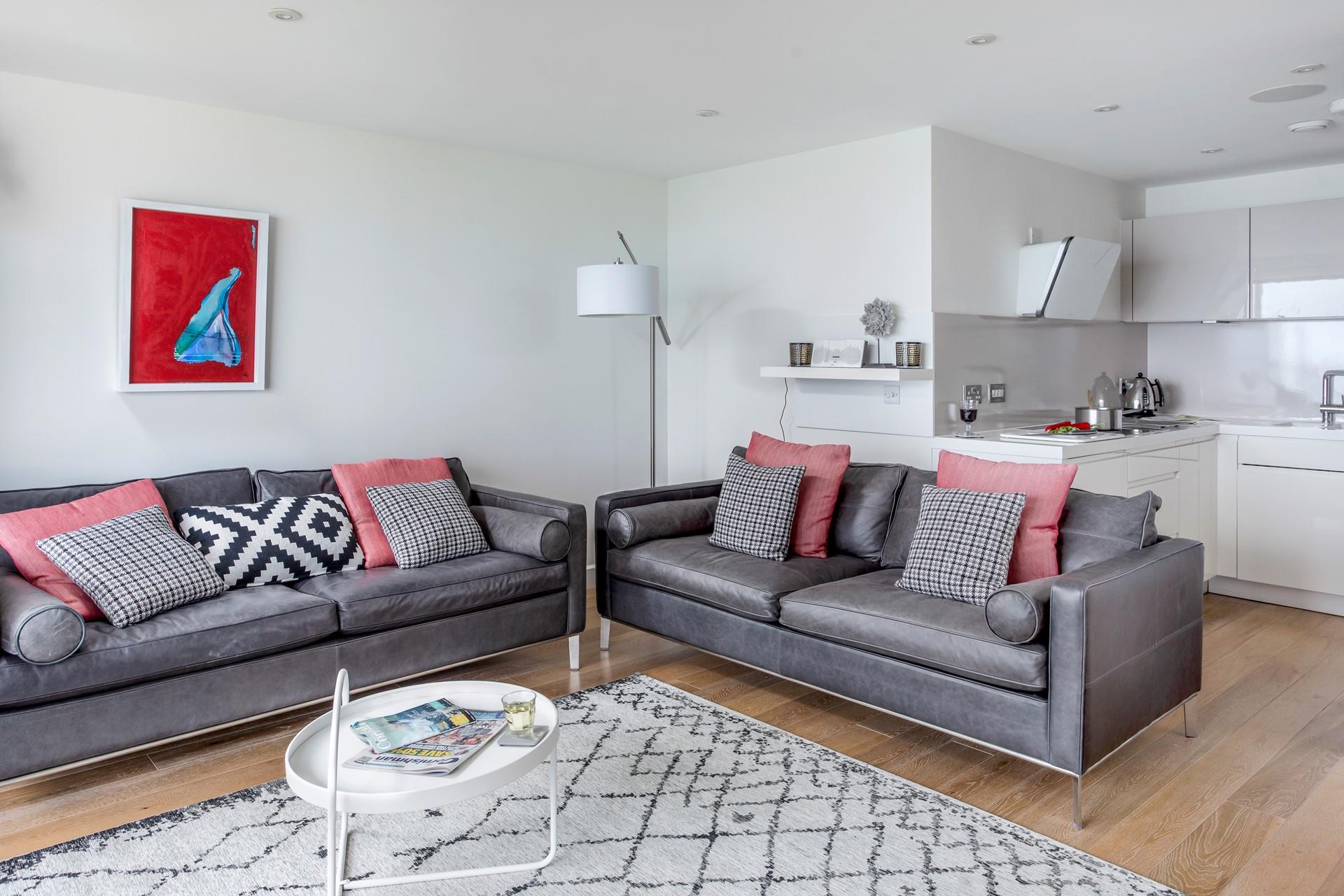 Relax in your luxurious sitting area with a glass of your favourite wine.