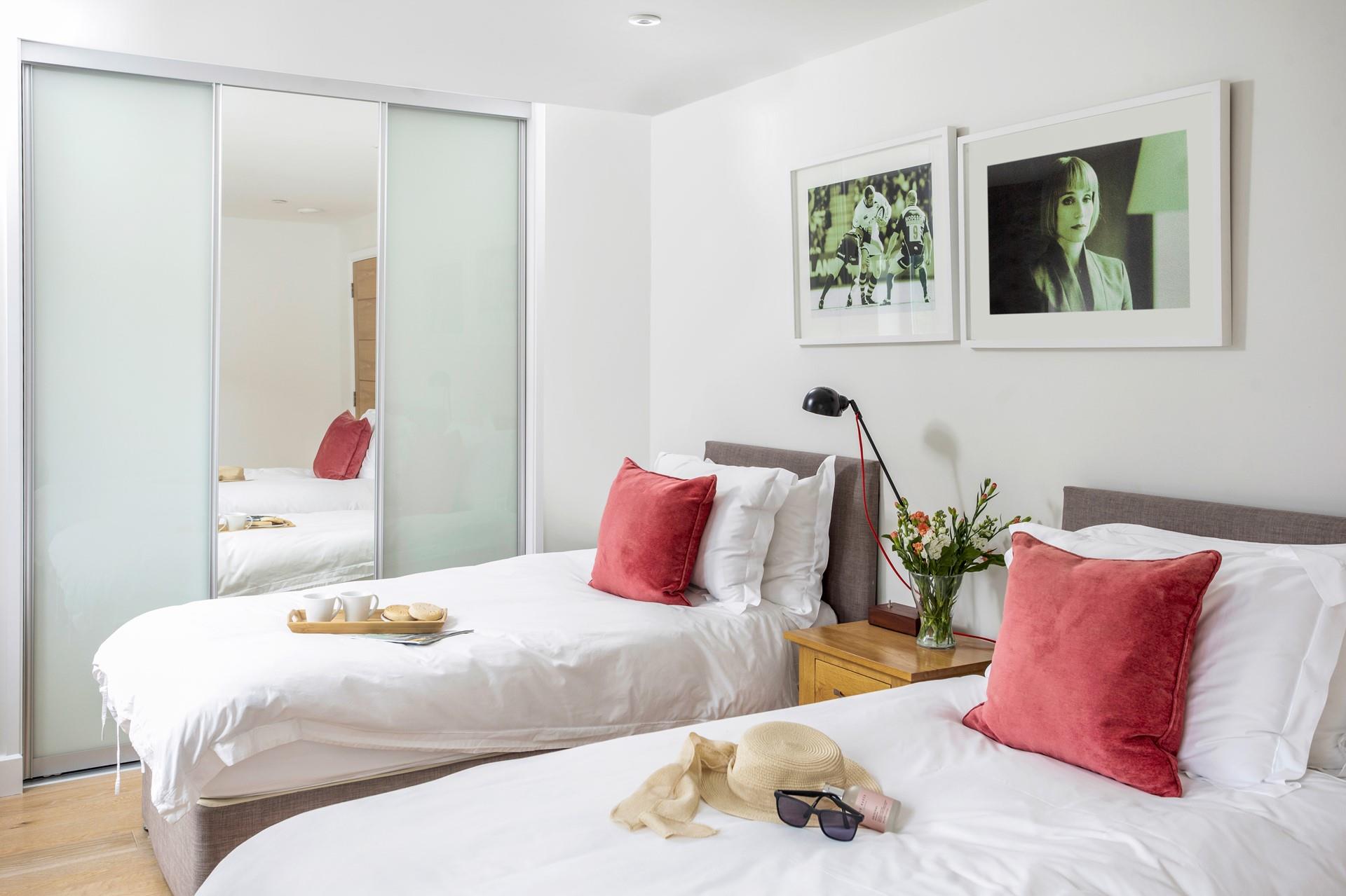 The twin bedroom is calm and cosy.