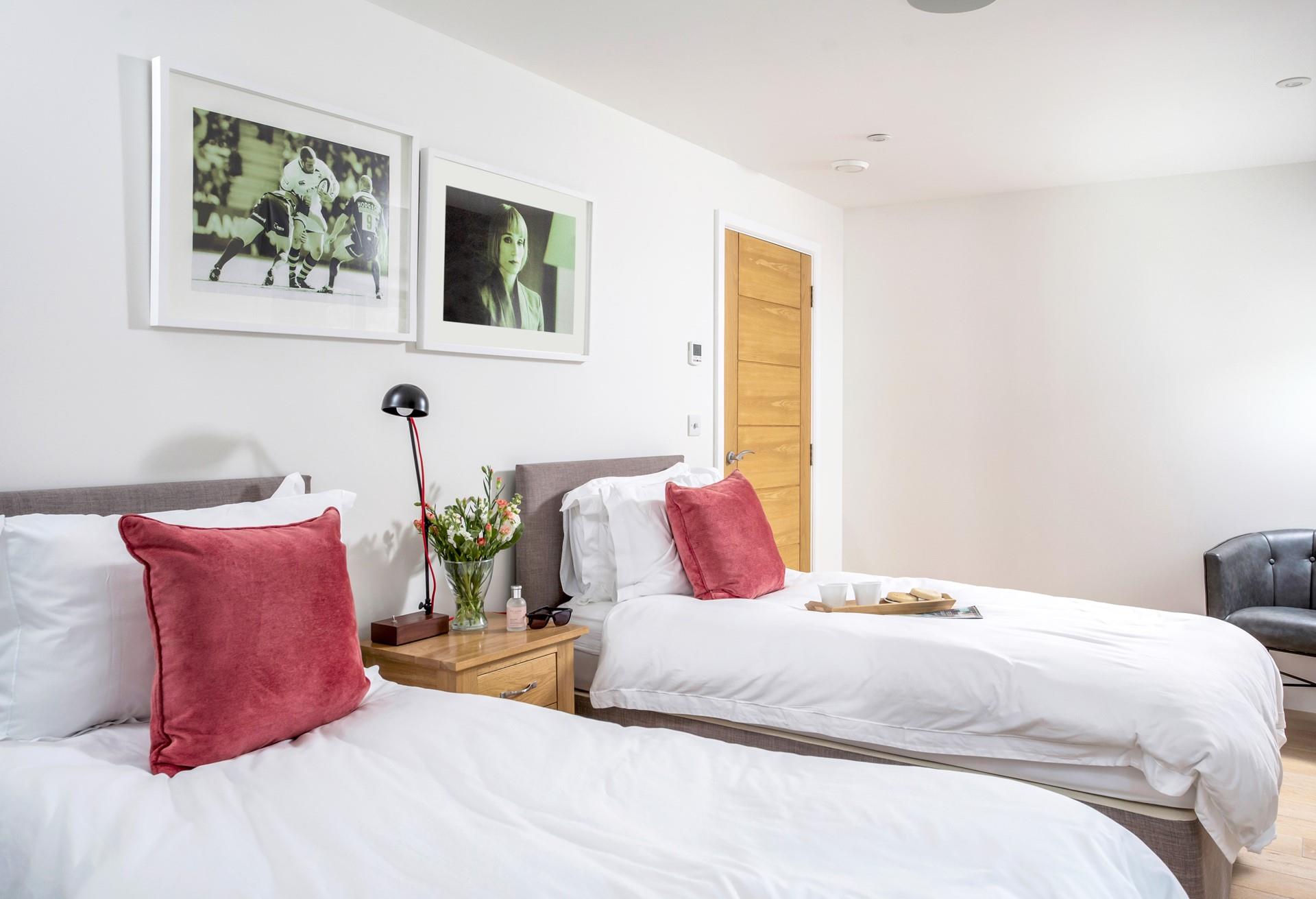 Chic artwork adorns the bedroom walls.