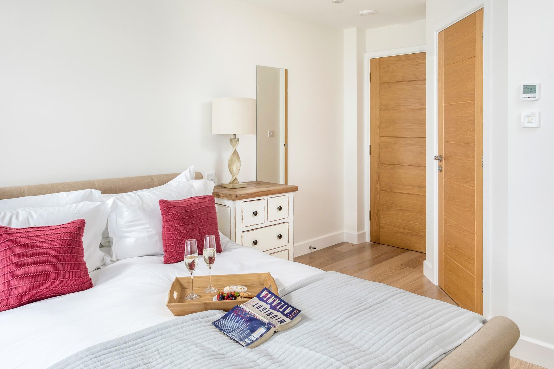 Pastel decor creates a calming bedroom for a restful night's sleep.