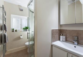 The bathroom is stylishly designed with modern fixings.