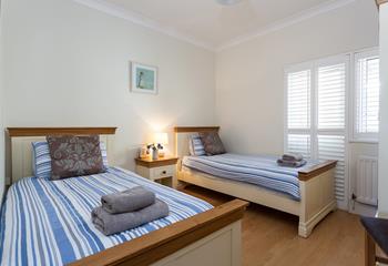 Bedroom 2 has twin beds that are perfect for both children and friends sharing.
