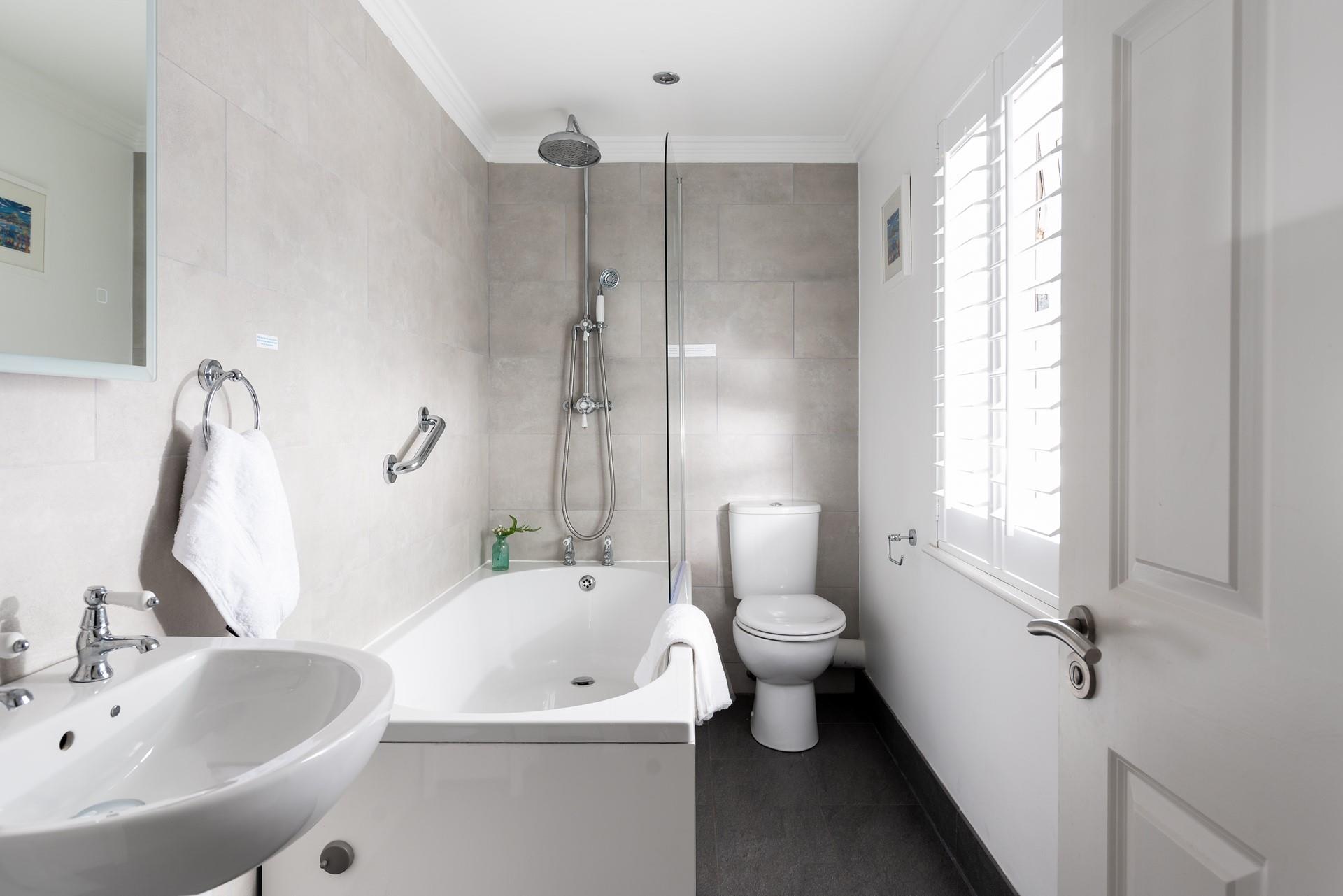 Start your day with an invigorating rinse under the rainfall showerhead.