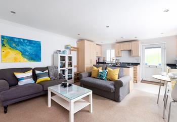 The living space blends fun seaside colours and a country chic style, creating a homely space to relax.