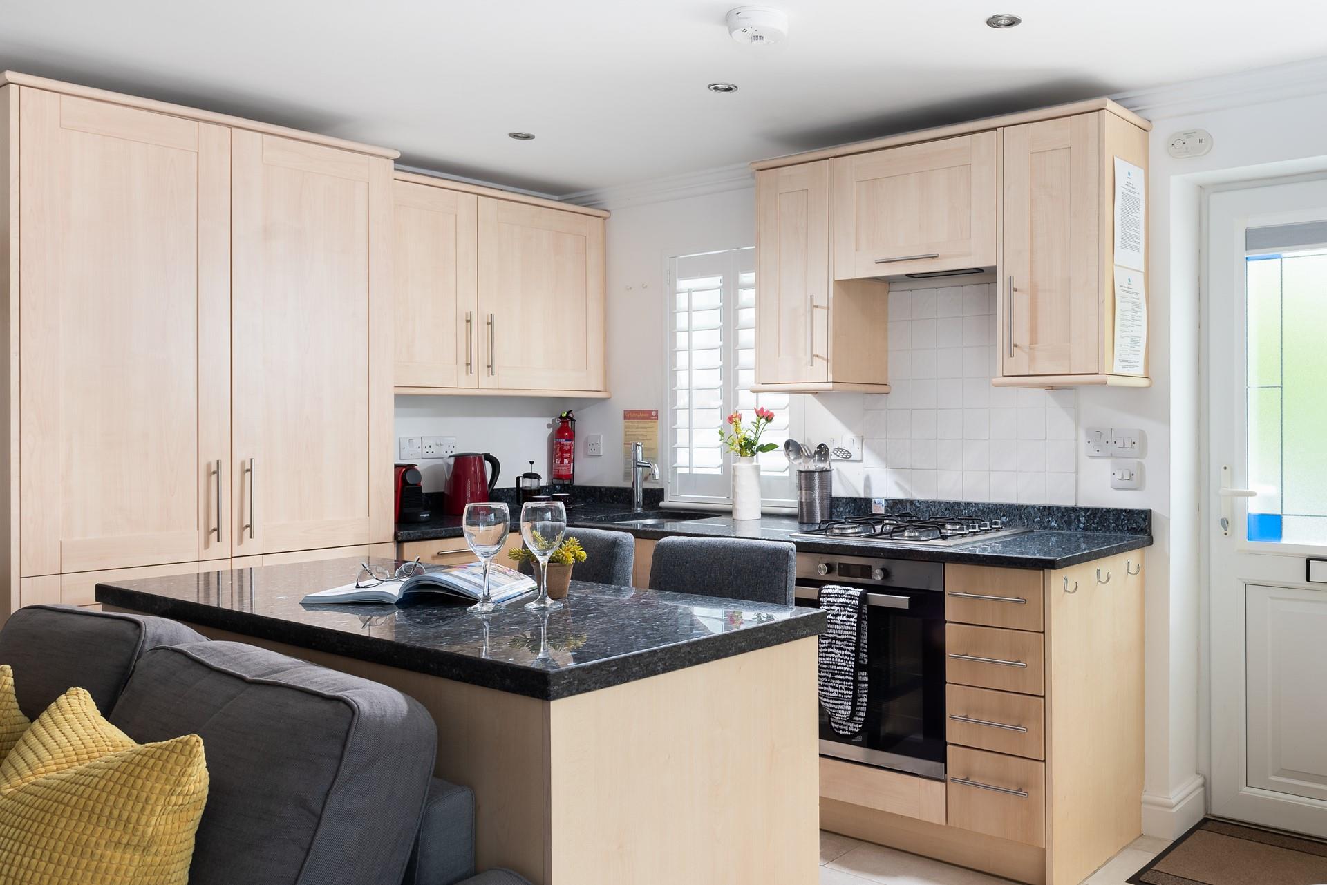Modern, spacious, and fabulously well-equipped, the kitchen is a delight to cook in.