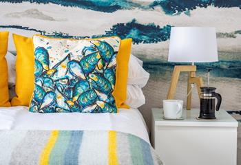 Eye-catching cushions adorn the bed.