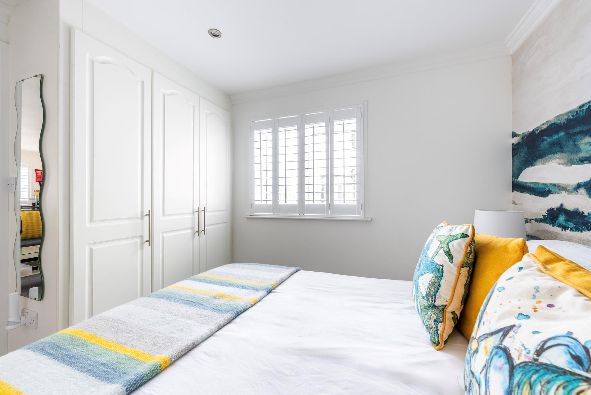 There's plenty of wardrobe space in this light and bright bedroom.