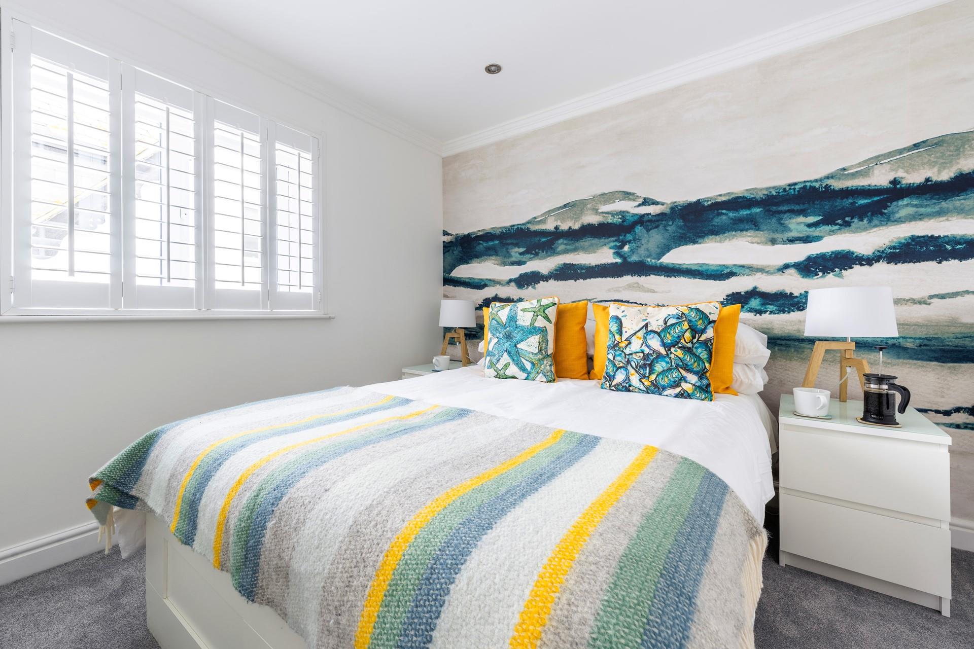 The colourful decor is an abstract nod to the coastal location.