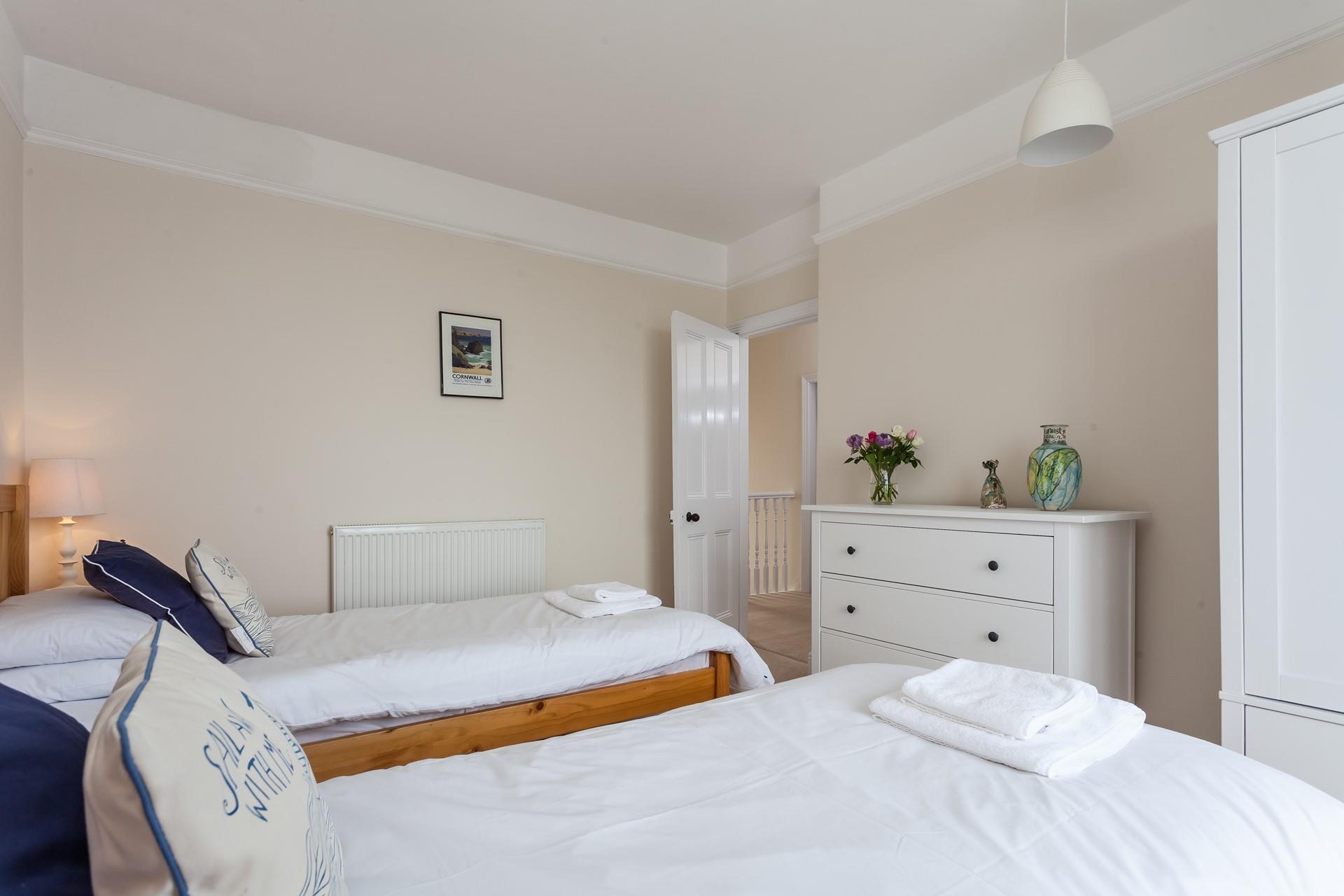 The twin beds provide a cosy space for children or adults to enjoy a restful night's sleep.