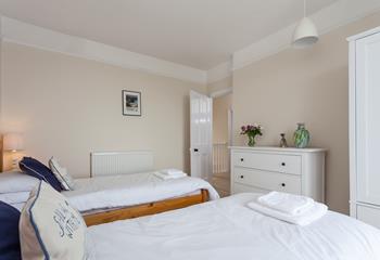 The twin beds provide a cosy space for children or adults to enjoy a restful night's sleep.
